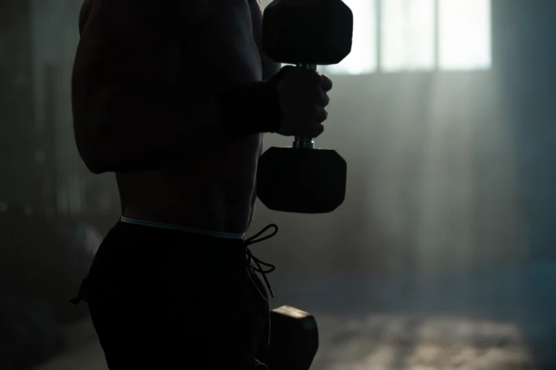 Groom Fitness Workout – Strength Training Before Wedding Man doing dumbbell curls in the gym for wedding strength training