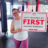 9Round Virginia Beach member celebrating her first kickboxing workout on Shore Drive