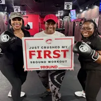 9Round Tallahassee FL member celebrating completion of a first kickboxing fitness workout