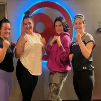 9Round Northville MI members posing together after a kickboxing fitness workout