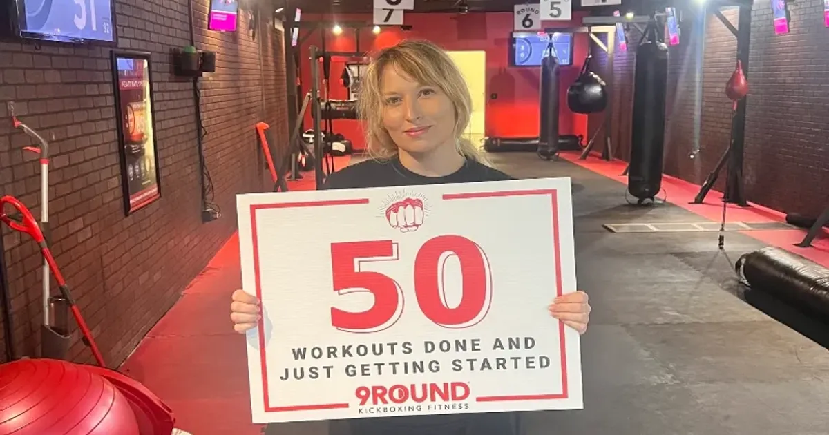 9Round Murfreesboro TN member celebrating the completion of 50 kickboxing fitness workouts