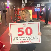 9Round Murfreesboro TN member celebrating the completion of 50 kickboxing fitness workouts