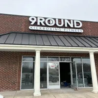 Exterior view of 9Round High Point NC gym on Samet Drive showing storefront and entrance