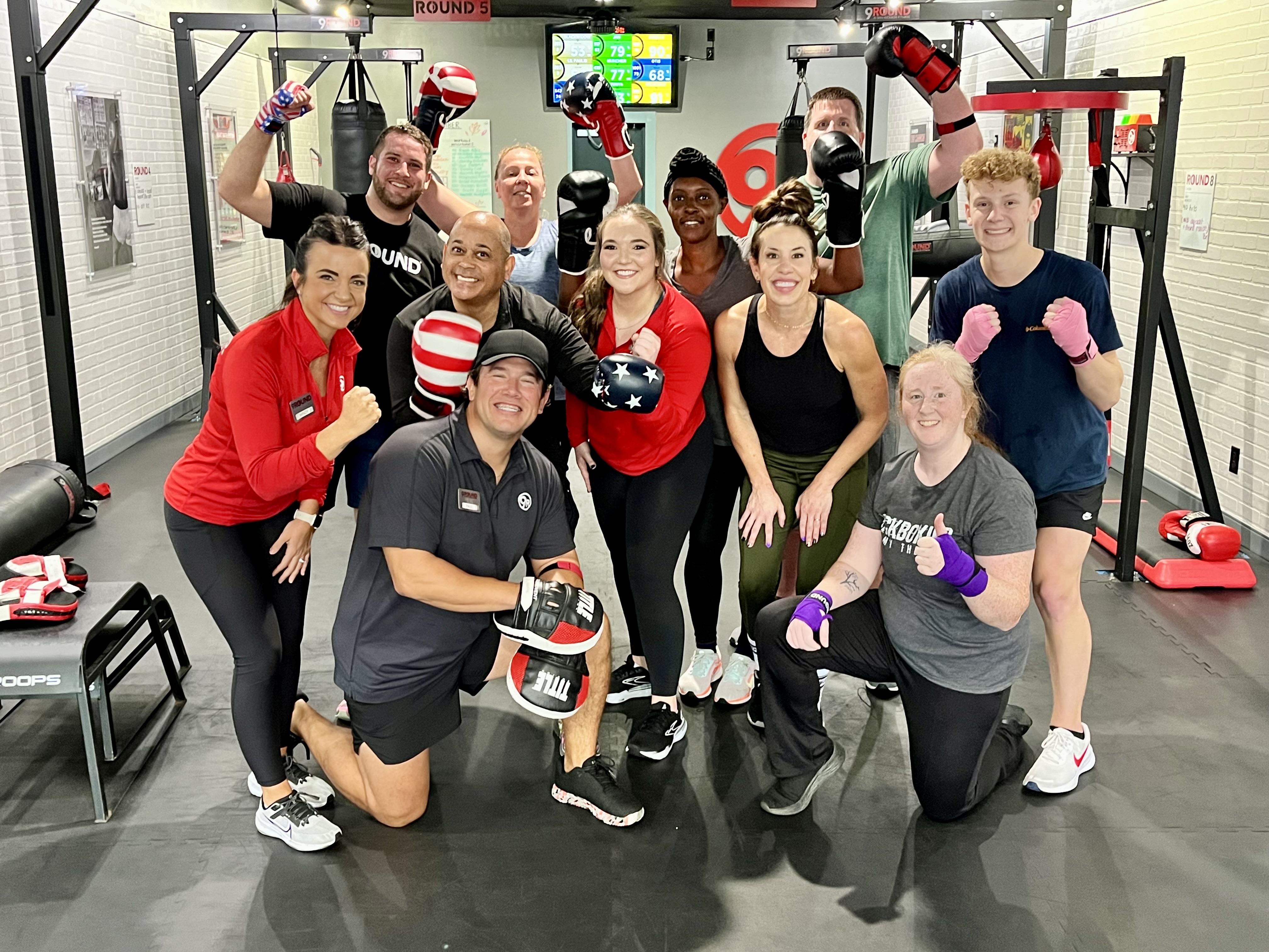 9Round team inside studio”
style=